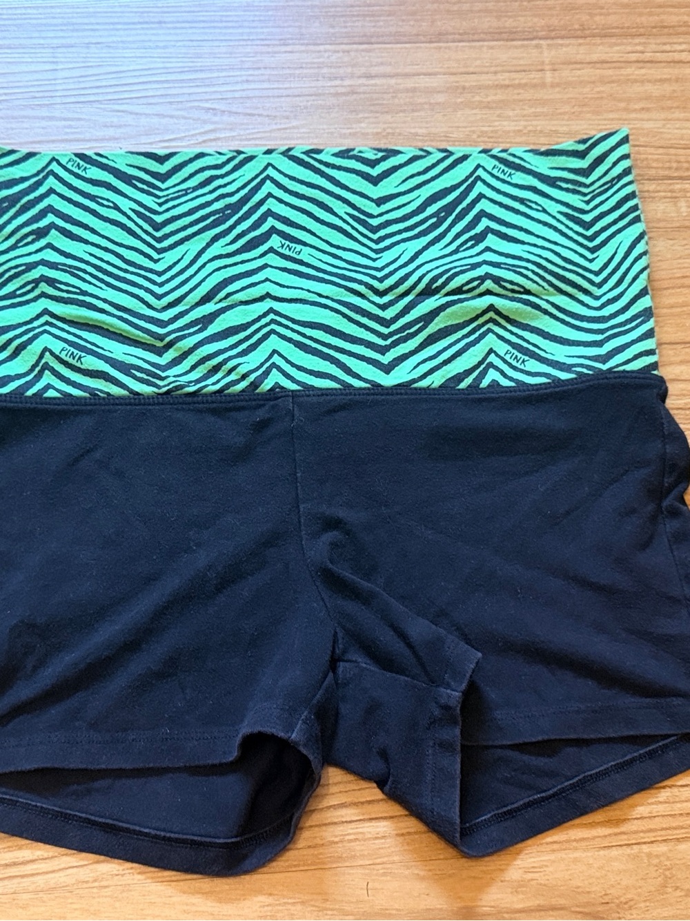 PINK Victoria's Secret roll-down Black Shorts with Green Zebra Waistband